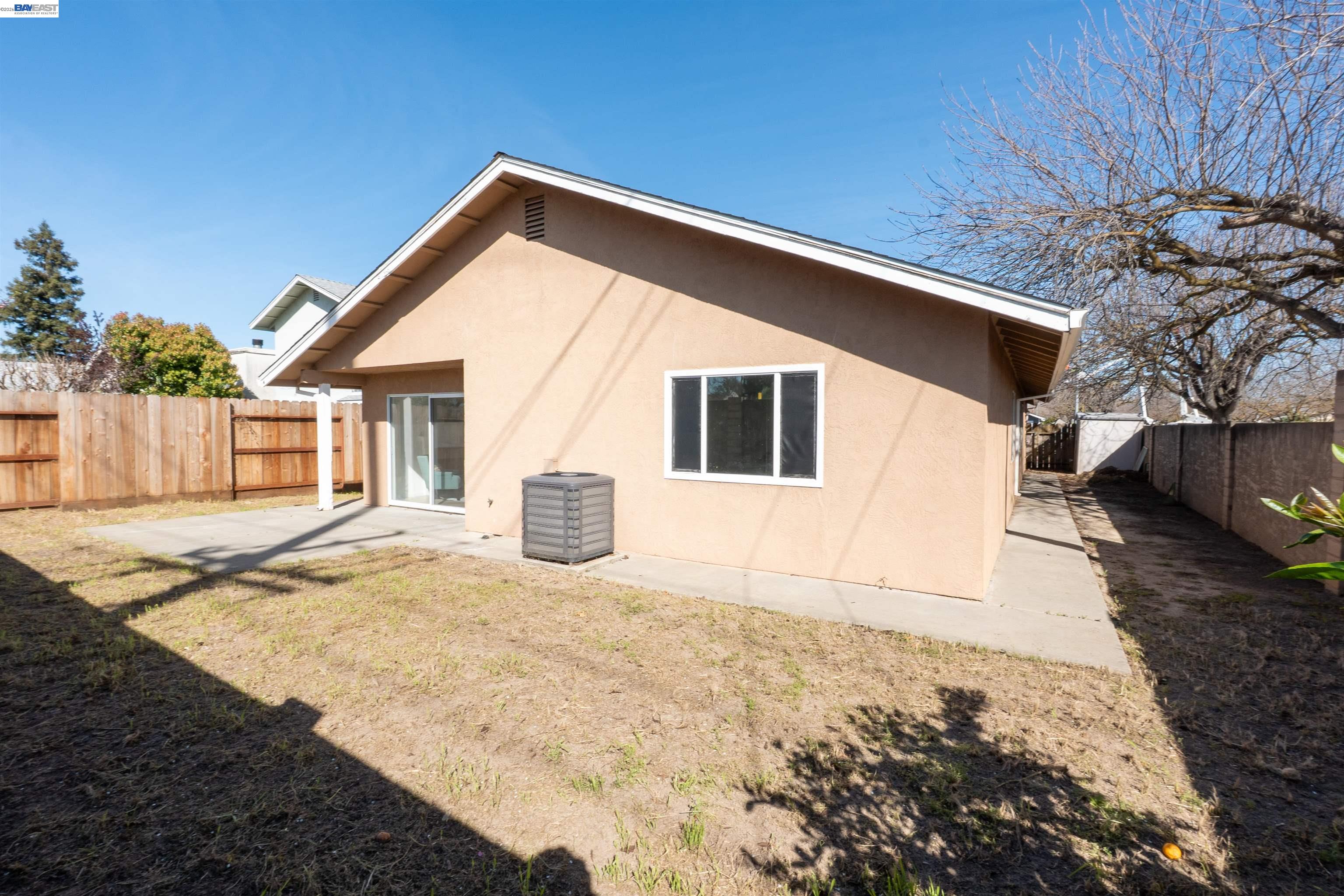 2932 Alcott Court Modesto, CA 95355 - Photo 5 of 39 a front view of a house with a yard
