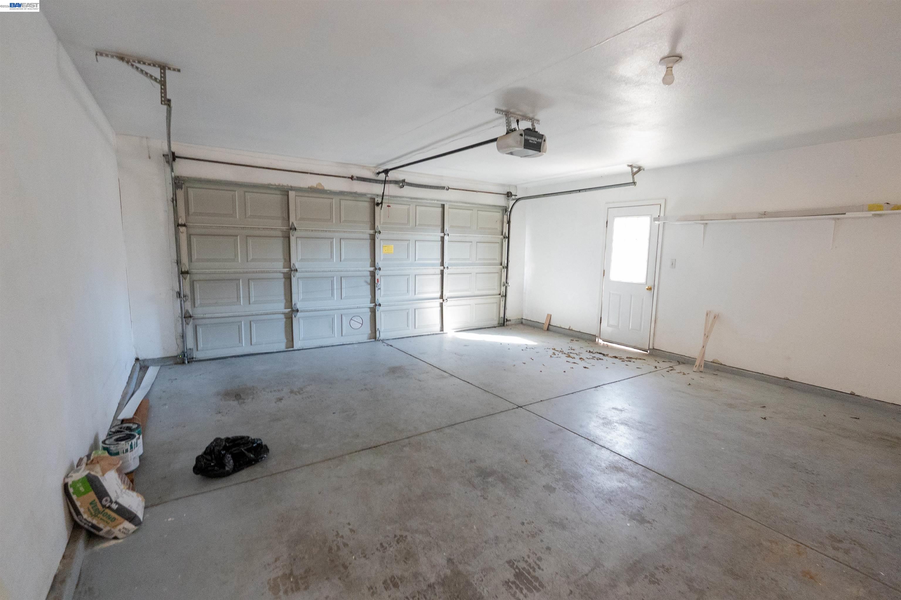 2932 Alcott Court Modesto, CA 95355 - Photo 7 of 39 a view of an empty room with garage and racks