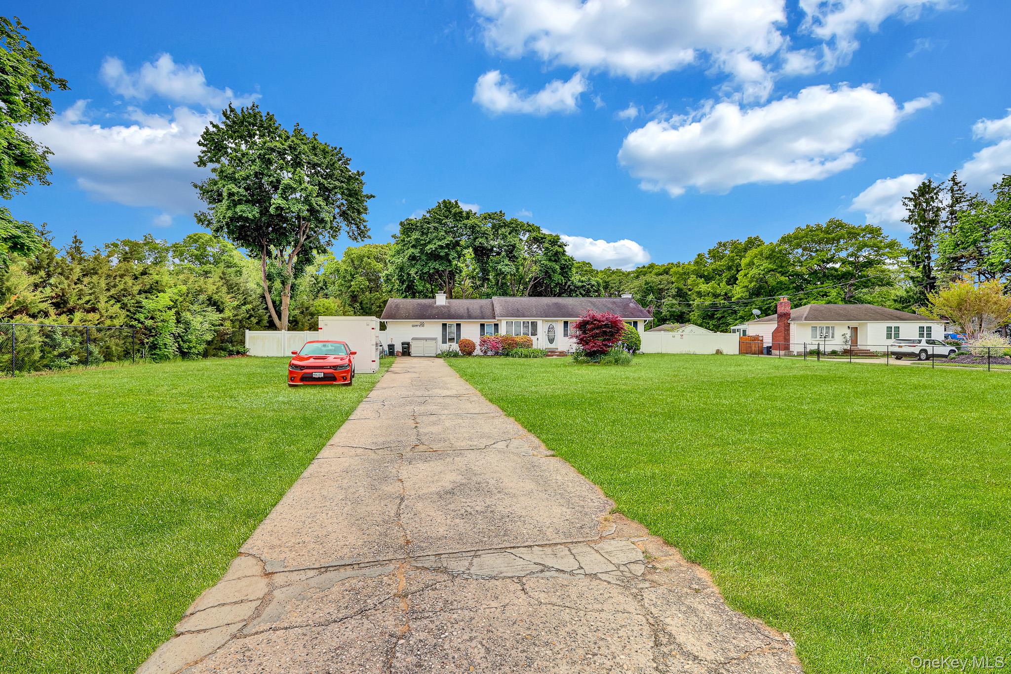 98 Granny Road Farmingville, NY 11738 - Photo 4 of 24 a view of yard with swimming pool and green space