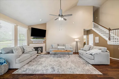 a living room with furniture and a fireplace