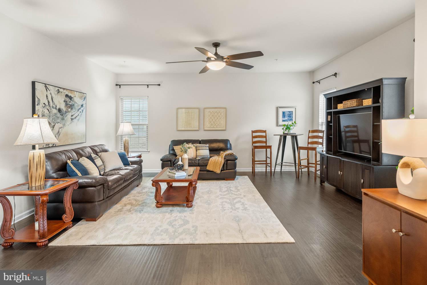 17883 Sugarberry Road Dumfries, VA 22026 - Photo 11 of 53 a living room with furniture and a flat screen tv