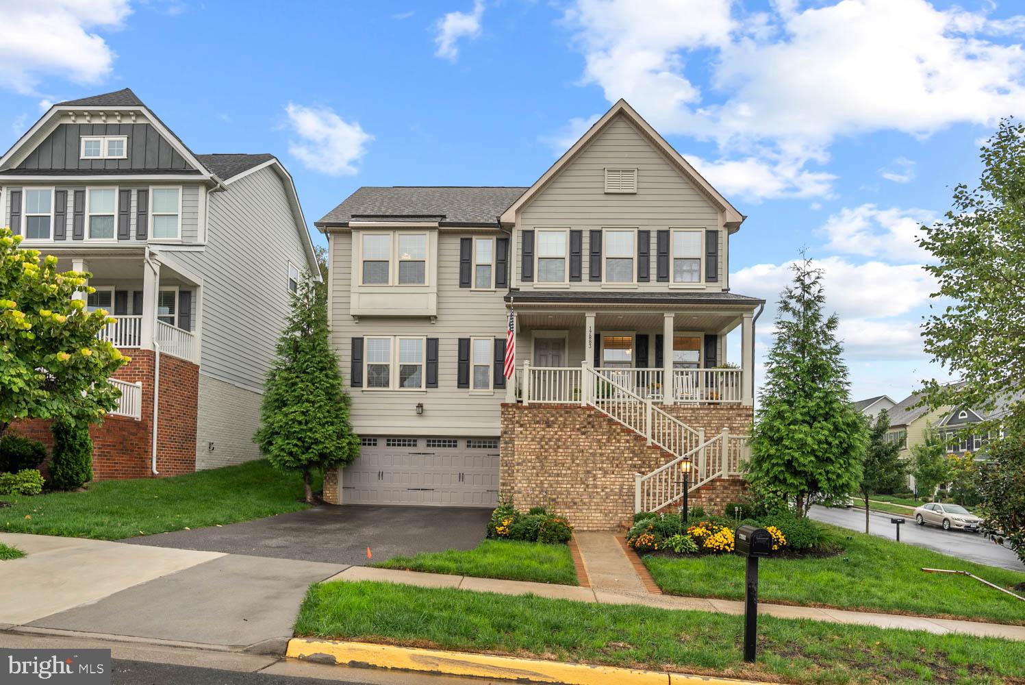 17883 Sugarberry Road Dumfries, VA 22026 - Photo 2 of 53 a front view of a house with a yard