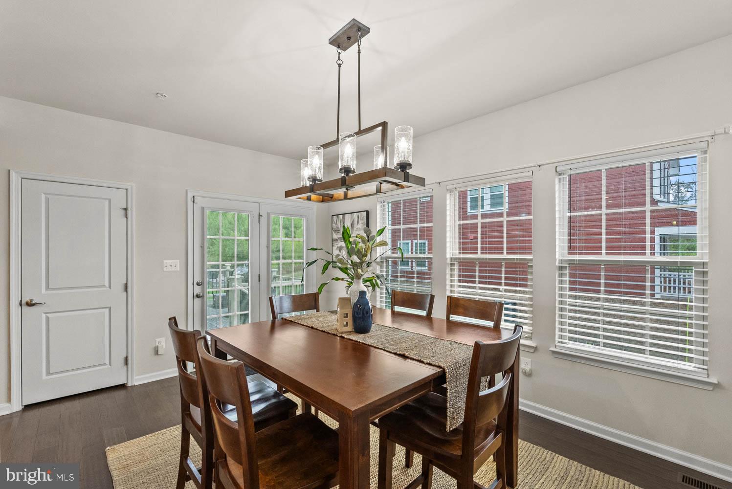 17883 Sugarberry Road Dumfries, VA 22026 - Photo 23 of 53 a view of a dining room with furniture window and wooden floor
