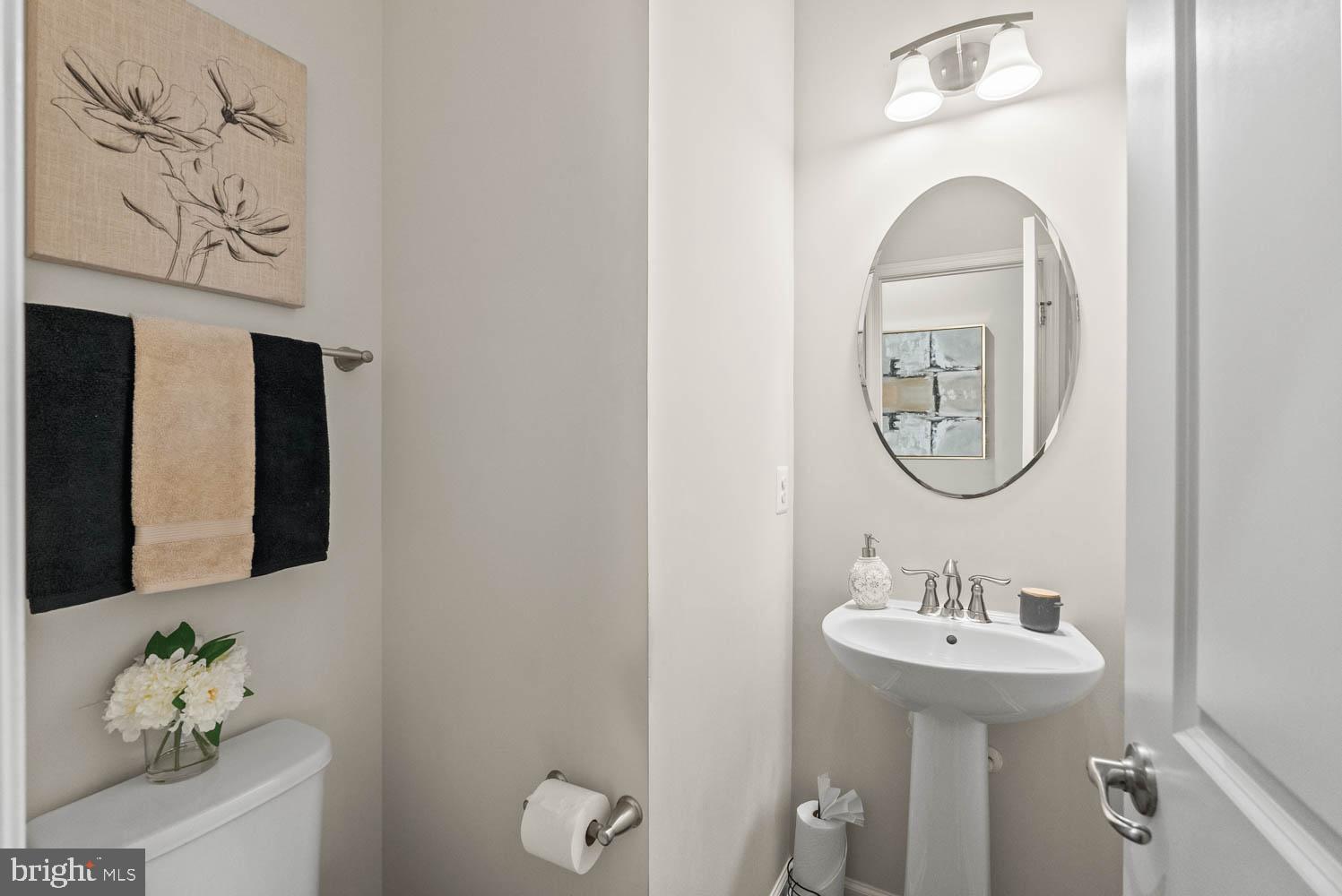 17883 Sugarberry Road Dumfries, VA 22026 - Photo 24 of 53 a bathroom with a sink and a mirror