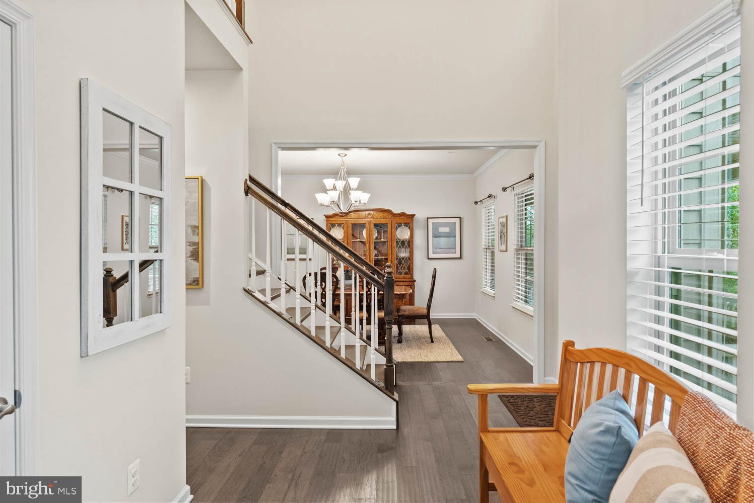 17883 Sugarberry Road Dumfries, VA 22026 - Photo 27 of 53 a living room with furniture windows and stairs