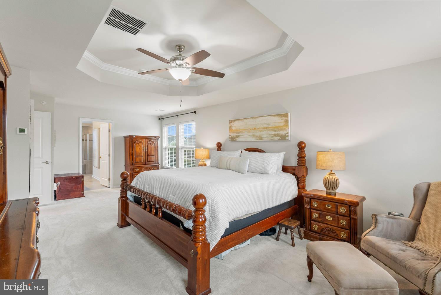 17883 Sugarberry Road Dumfries, VA 22026 - Photo 29 of 53 a bed room with a bed and a chandelier