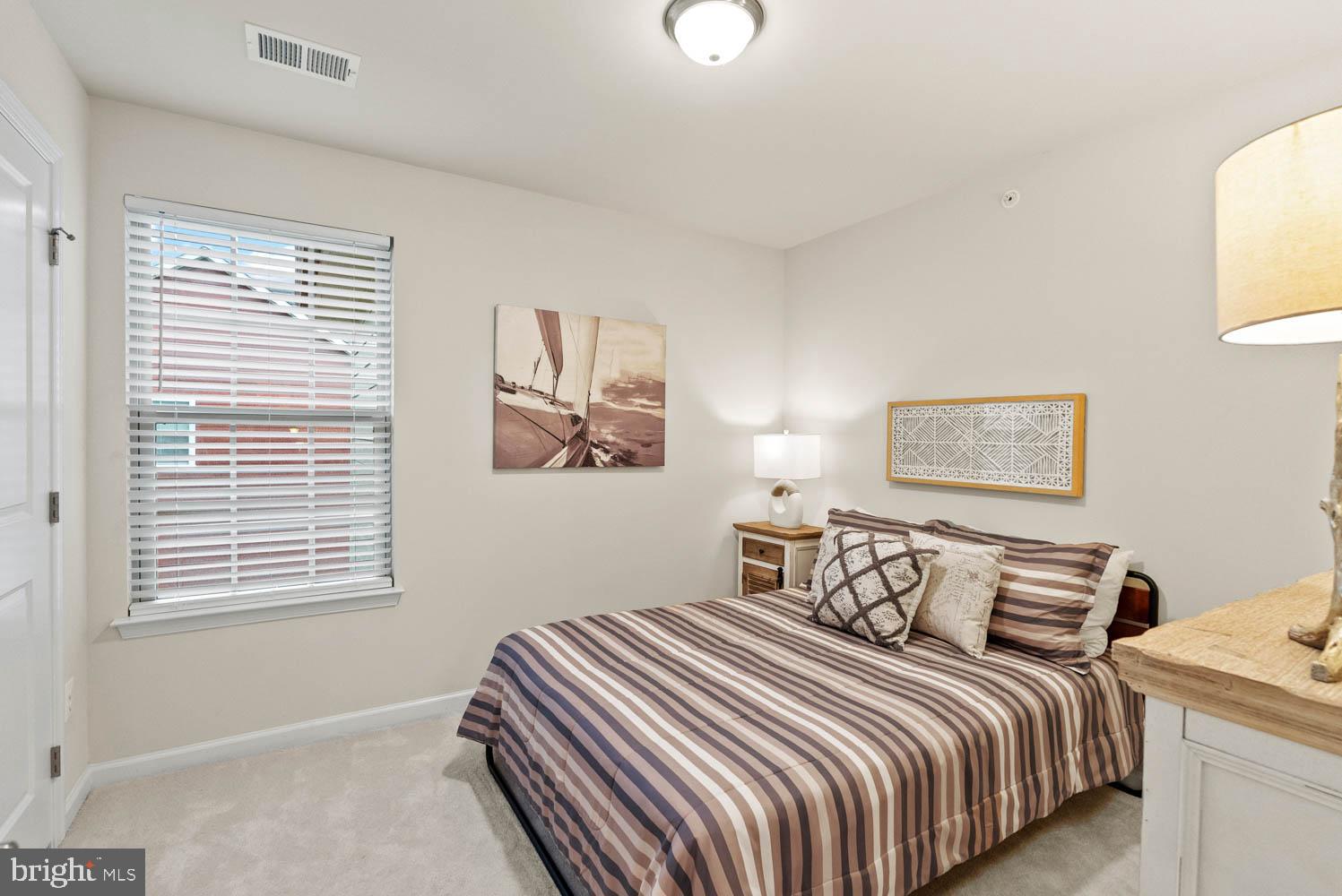 17883 Sugarberry Road Dumfries, VA 22026 - Photo 36 of 53 a bedroom with bed and a window