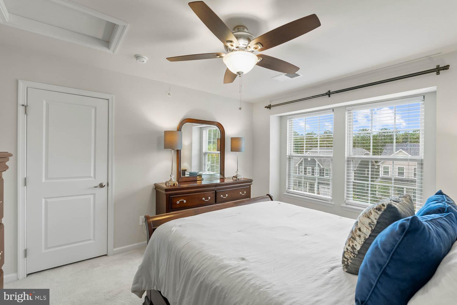 17883 Sugarberry Road Dumfries, VA 22026 - Photo 39 of 53 a bedroom with a bed and a large window with the outer view