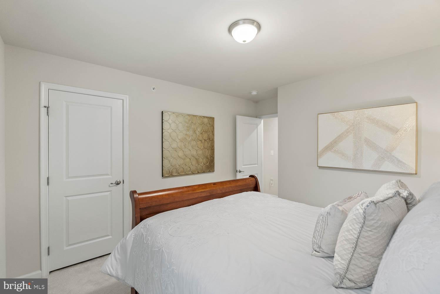 17883 Sugarberry Road Dumfries, VA 22026 - Photo 41 of 53 a bedroom with a bed and a painting on the wall