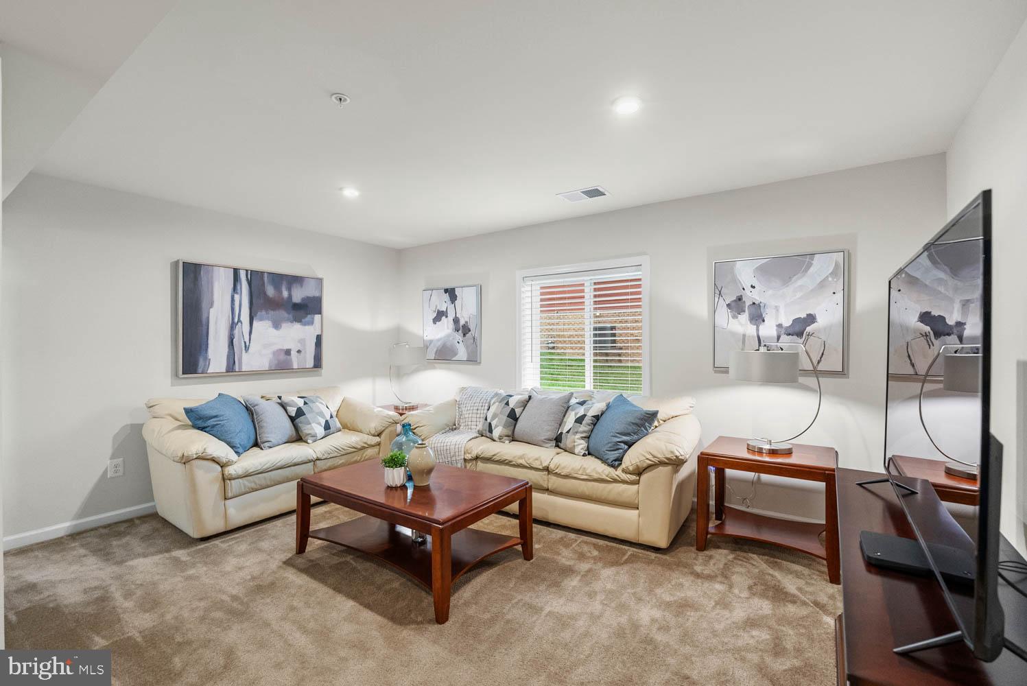 17883 Sugarberry Road Dumfries, VA 22026 - Photo 49 of 53 a living room with furniture and a large window