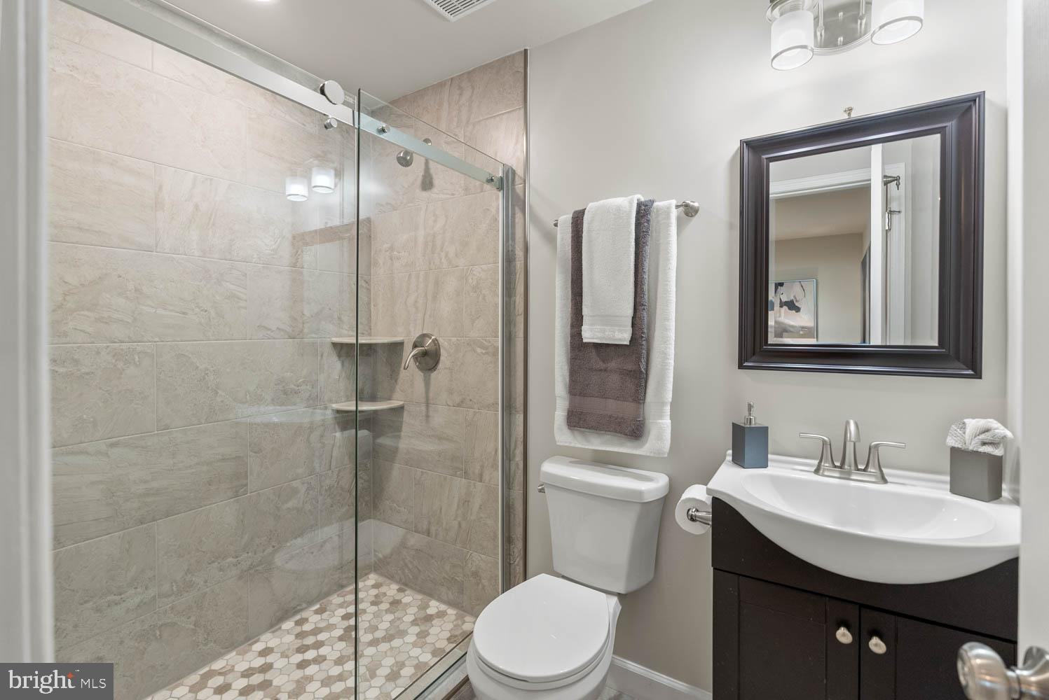 17883 Sugarberry Road Dumfries, VA 22026 - Photo 50 of 53 a bathroom with a sink toilet and shower