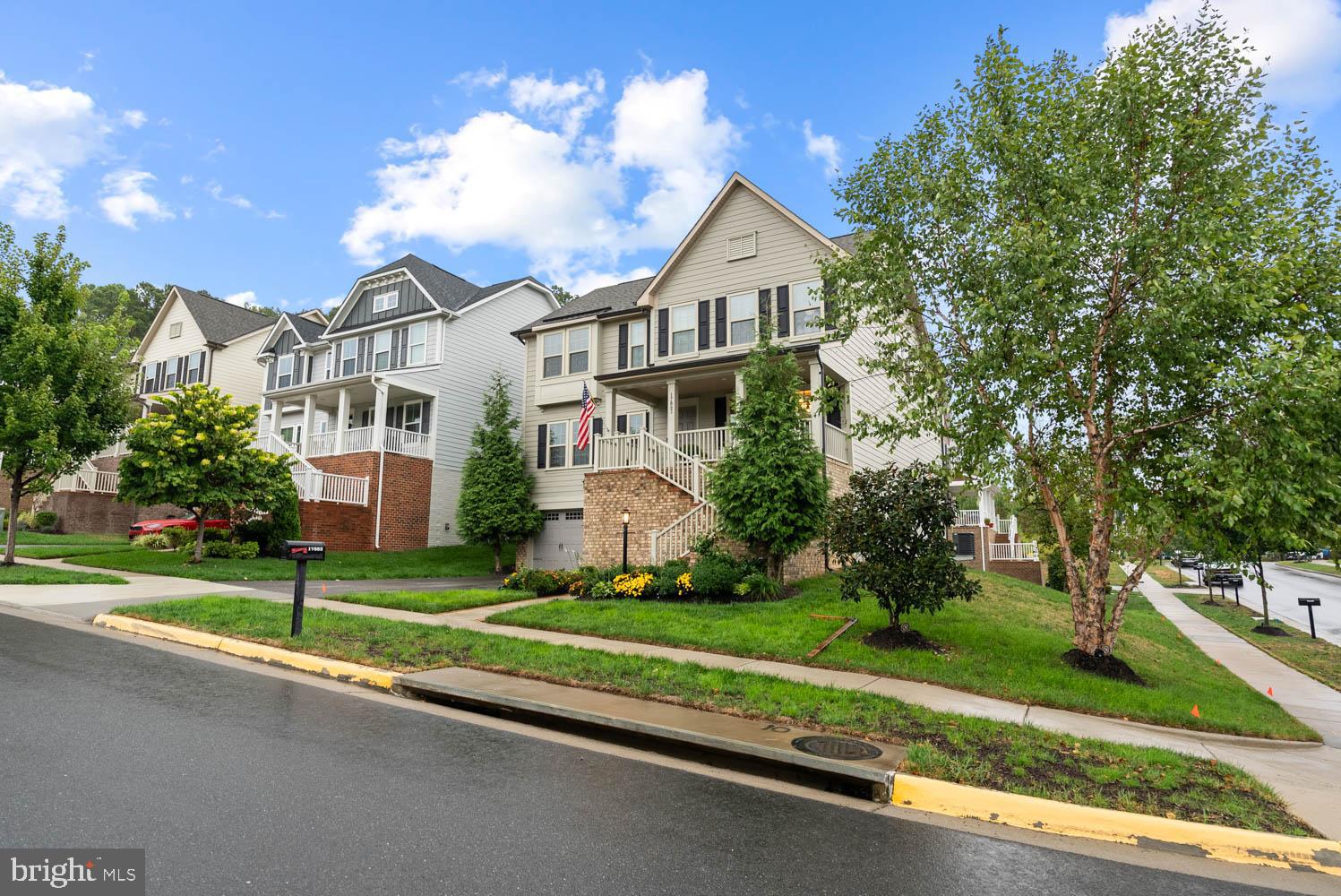 17883 Sugarberry Road Dumfries, VA 22026 - Photo 51 of 53 a front view of a house with a yard and garage