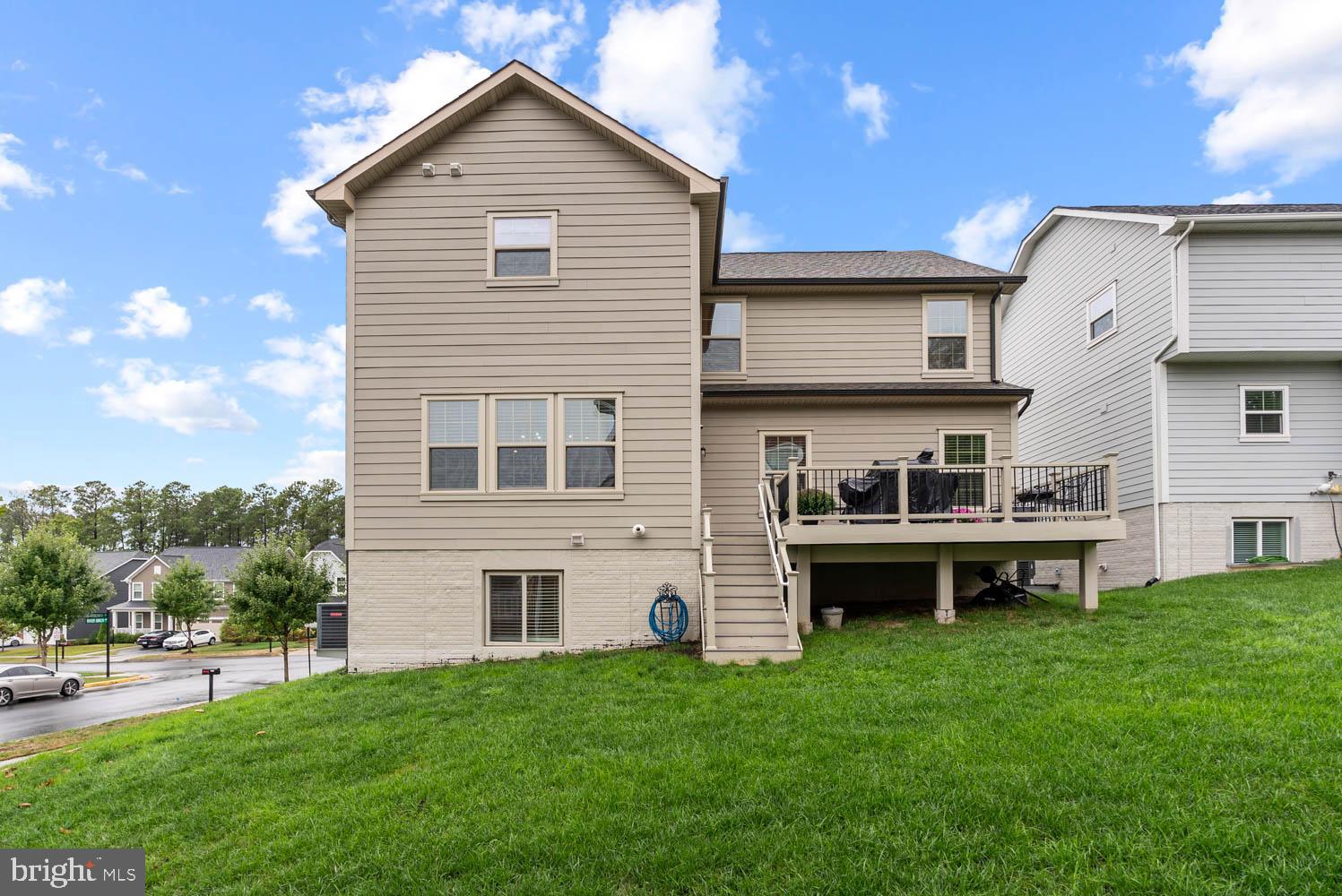 17883 Sugarberry Road Dumfries, VA 22026 - Photo 52 of 53 a view of an house with backyard space and balcony