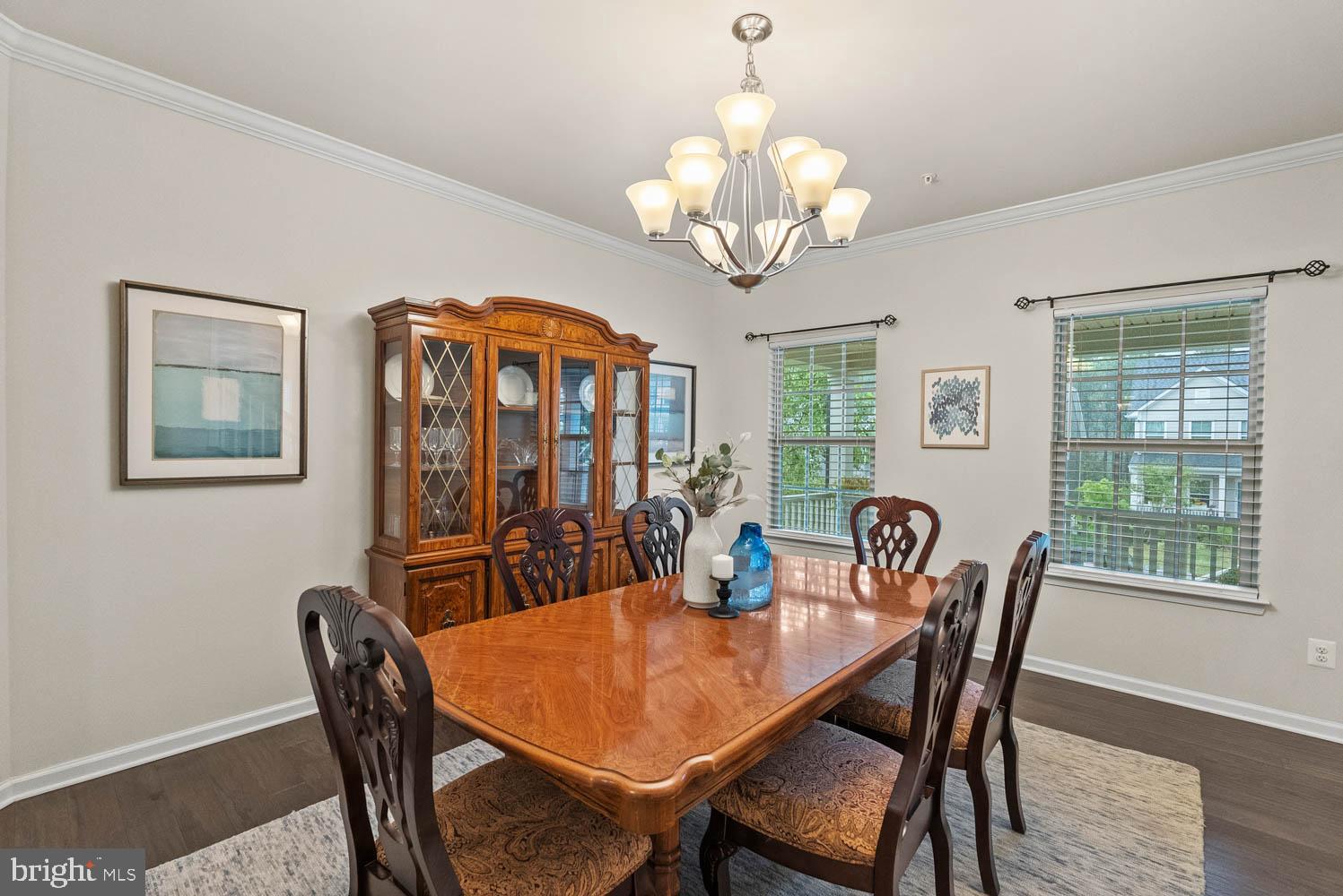 17883 Sugarberry Road Dumfries, VA 22026 - Photo 10 of 53 a view of a dining room with furniture wooden floor and chandelier