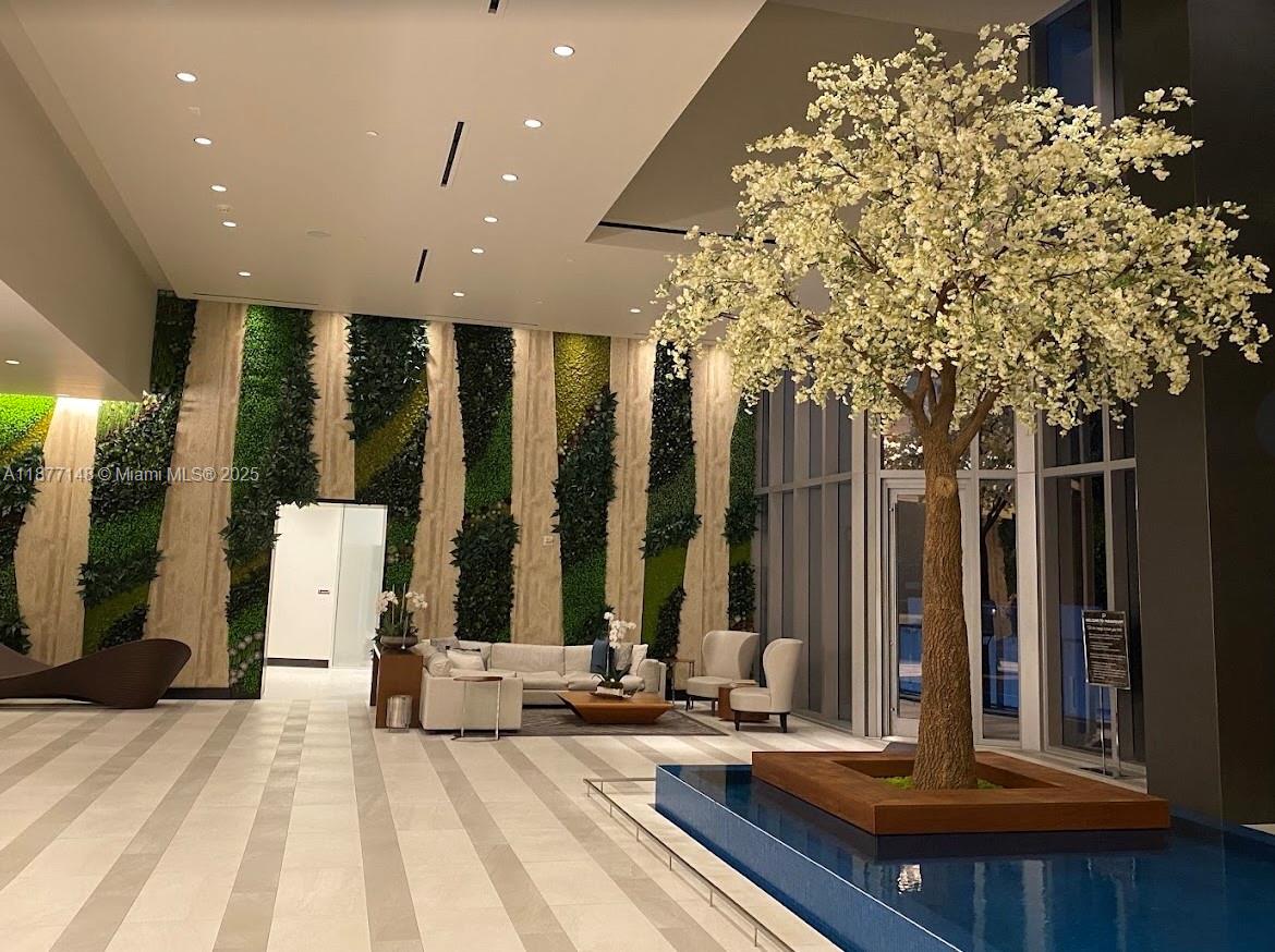 851 Northeast 1st Avenue, Unit 302 Miami, FL 33132 - Photo 12 of 30 a view of swimming pool with chairs