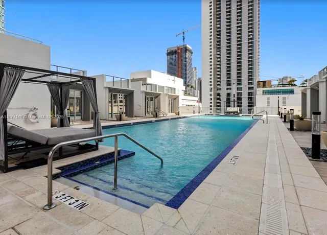 a view of a patio with a table and chairs