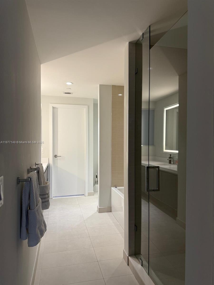 851 Northeast 1st Avenue, Unit 302 Miami, FL 33132 - Photo 23 of 30 a view of walk in closet