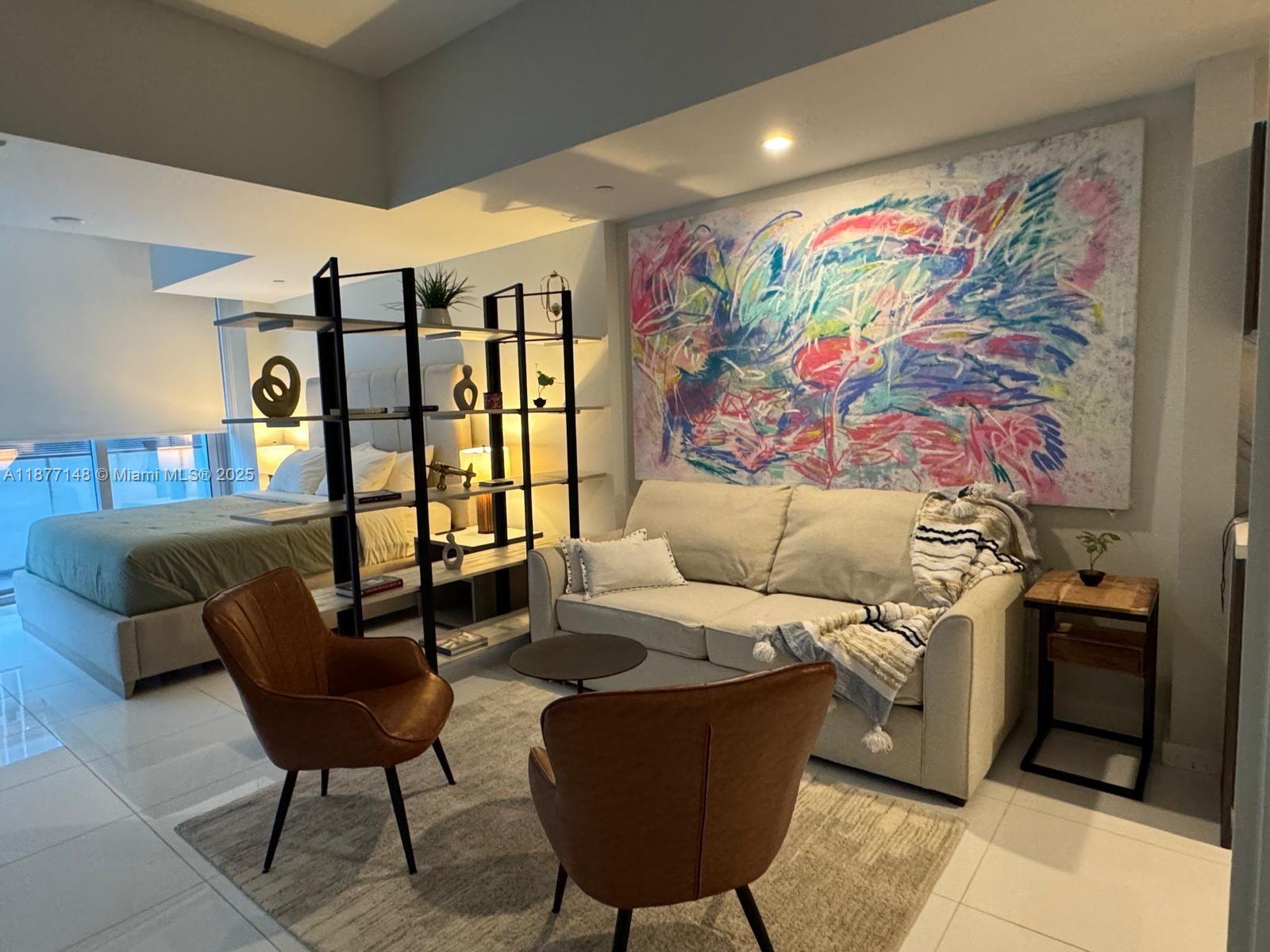 851 Northeast 1st Avenue, Unit 302 Miami, FL 33132 - Photo 30 of 30 a living room with furniture and wall paintings