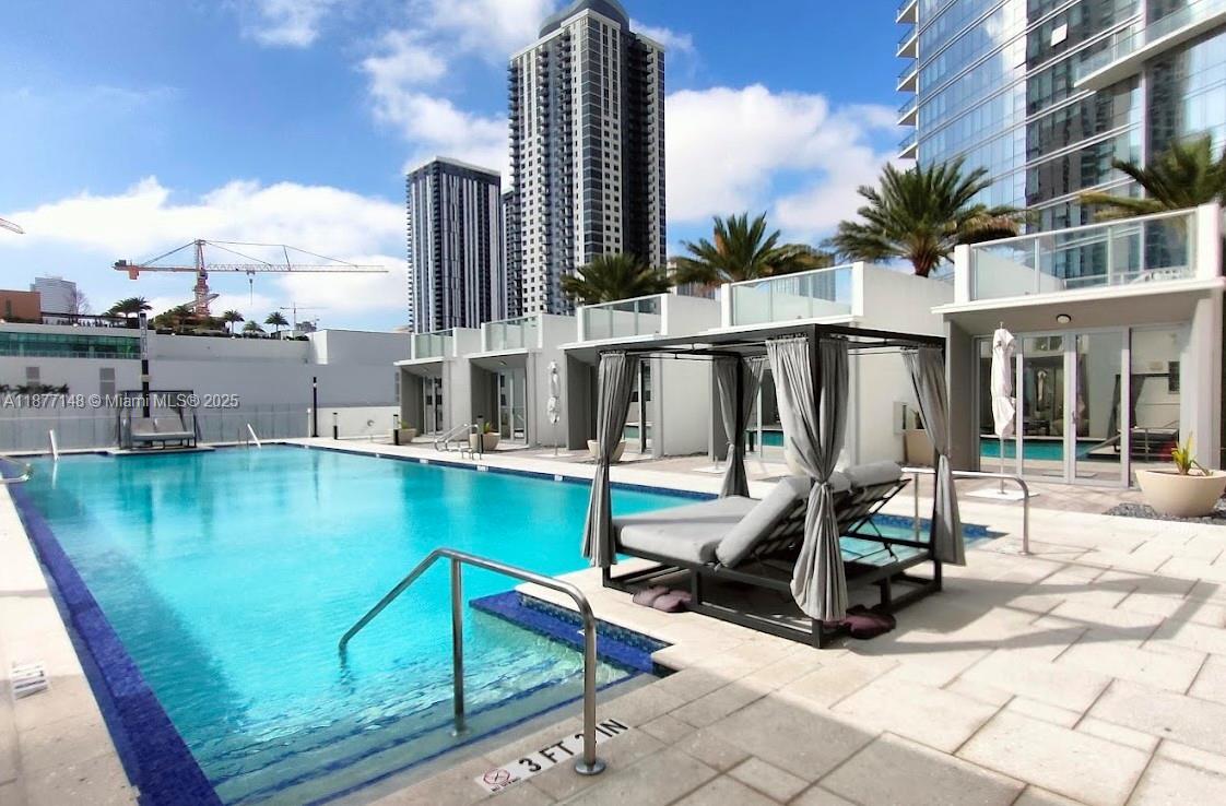851 Northeast 1st Avenue, Unit 302 Miami, FL 33132 - Photo 5 of 30 a view of swimming pool with seating area