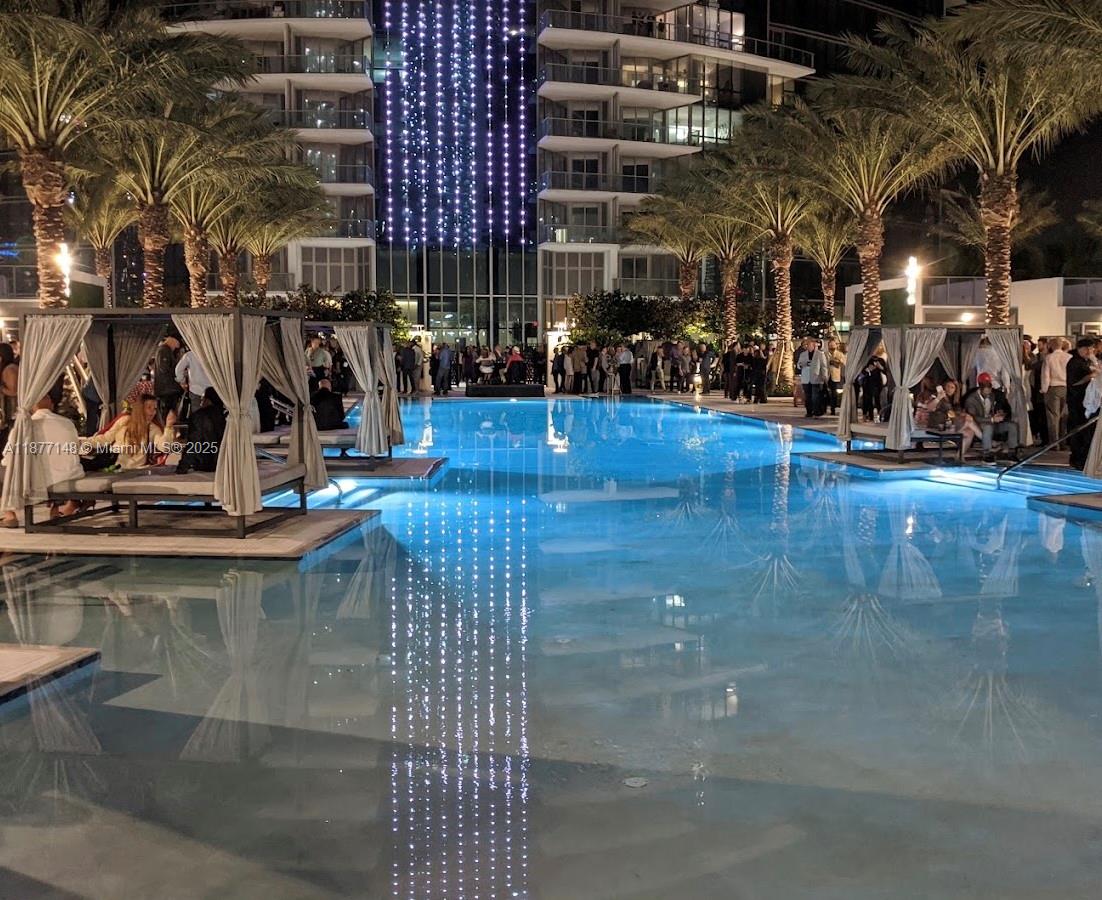 851 Northeast 1st Avenue, Unit 302 Miami, FL 33132 - Photo 7 of 30 a view of a room with wooden floor