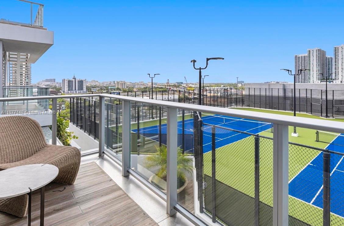 851 Northeast 1st Avenue, Unit 302 Miami, FL 33132 - Photo 8 of 30 a view of a balcony with furniture