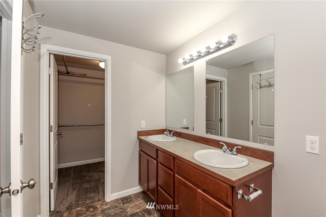 36313 Allen Road South Roy, WA 98580 - Photo 17 of 20 a bathroom with a sink double vanity and a mirror