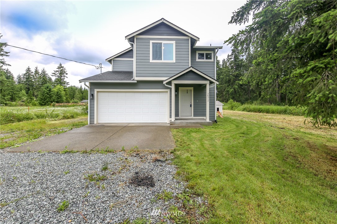 36313 Allen Road South Roy, WA 98580 - Photo 19 of 20 a front view of a house with a yard and garage