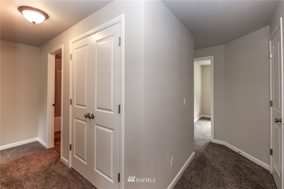 36313 Allen Road South Roy, WA 98580 - Photo 8 of 20 a view of a hallway with closet and bathroom