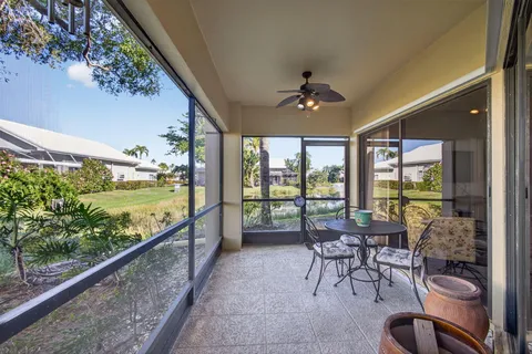 a view of a glass door and a balcony