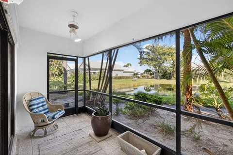 a view of a porch and garden