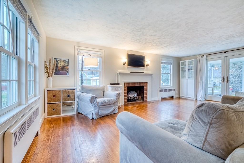 49 Jean Street Framingham, MA 01701 - Photo 11 of 41 a living room with furniture and a fireplace