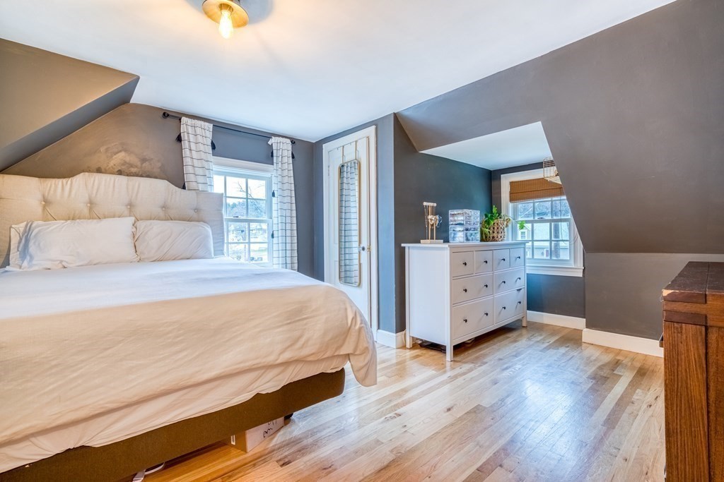 49 Jean Street Framingham, MA 01701 - Photo 14 of 41 a bedroom with a bed and wooden floor