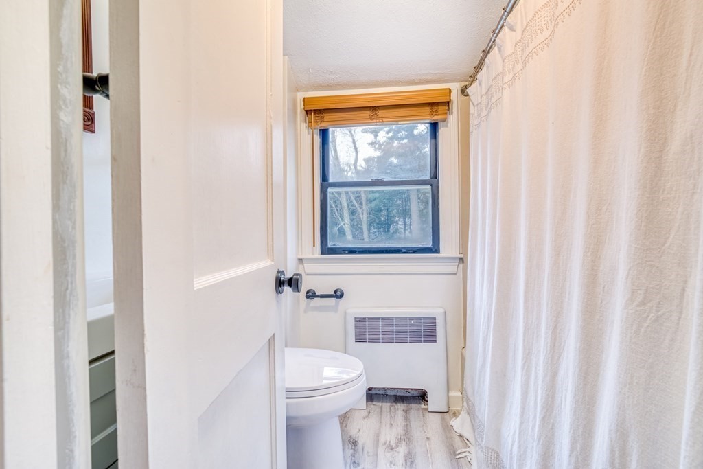 49 Jean Street Framingham, MA 01701 - Photo 19 of 41 a white toilet sitting next to a bathroom sink