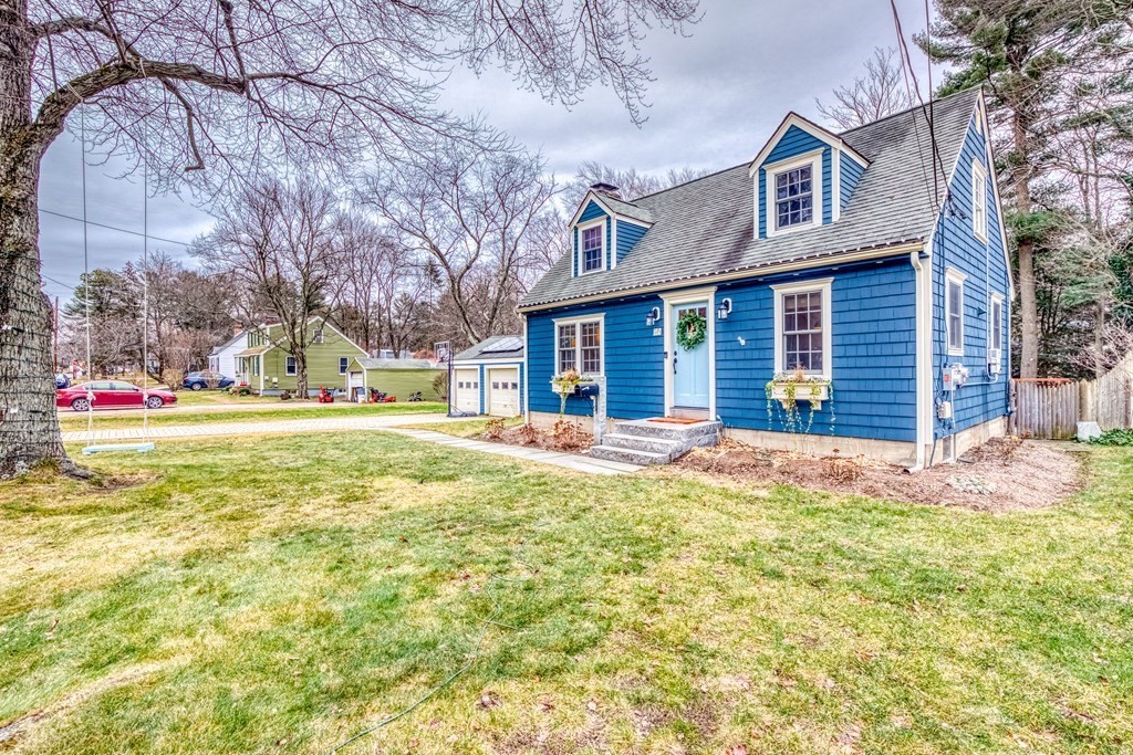 49 Jean Street Framingham, MA 01701 - Photo 2 of 41 a view of a house with a yard and garage