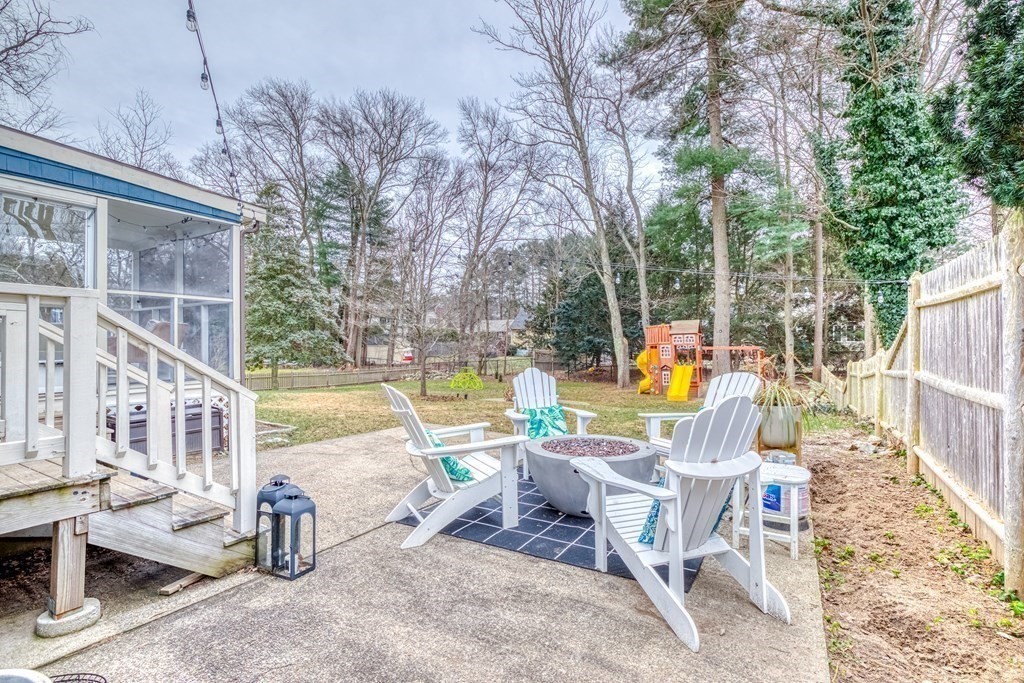 49 Jean Street Framingham, MA 01701 - Photo 22 of 41 a view of a swimming pool with chairs and table in the patio