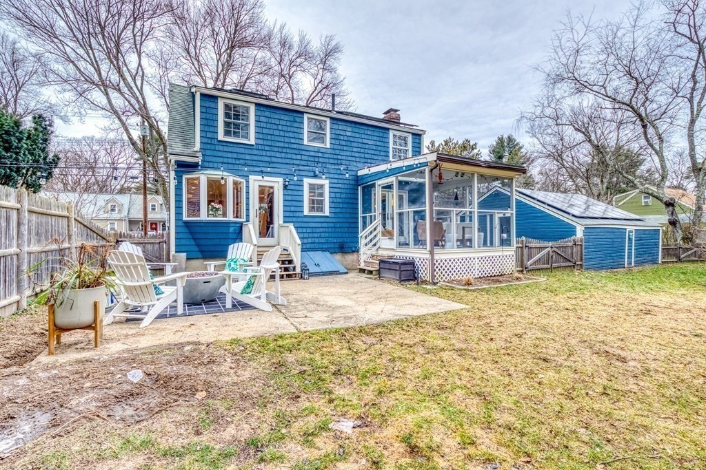 49 Jean Street Framingham, MA 01701 - Photo 24 of 41 a front view of a house with a yard patio and wooden fence