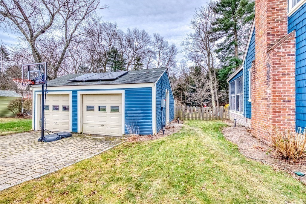 49 Jean Street Framingham, MA 01701 - Photo 31 of 41 a view of a house with a small yard and large tree