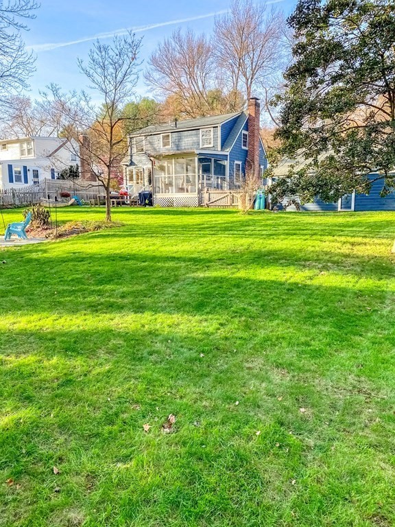 49 Jean Street Framingham, MA 01701 - Photo 39 of 41 a view of a building with a big yard and large trees