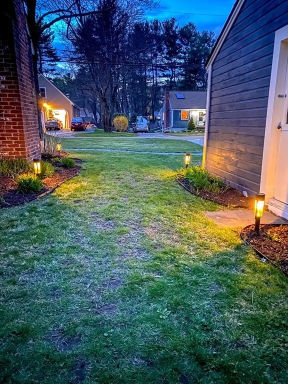 49 Jean Street Framingham, MA 01701 - Photo 41 of 41 a view of a backyard with plants and a patio