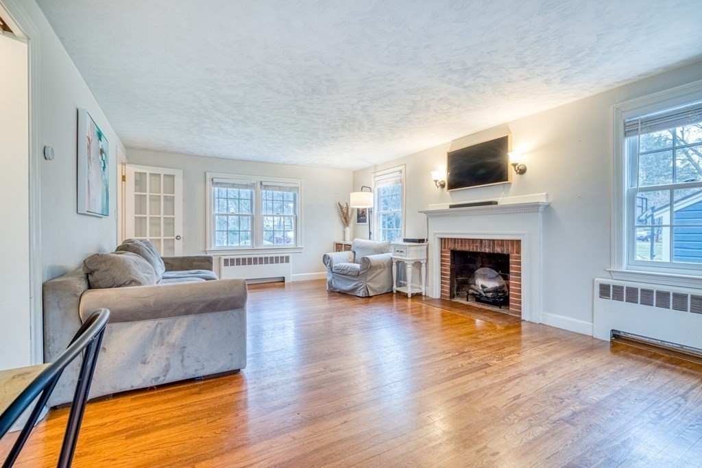 49 Jean Street Framingham, MA 01701 - Photo 9 of 41 a living room with furniture fireplace and flat screen tv