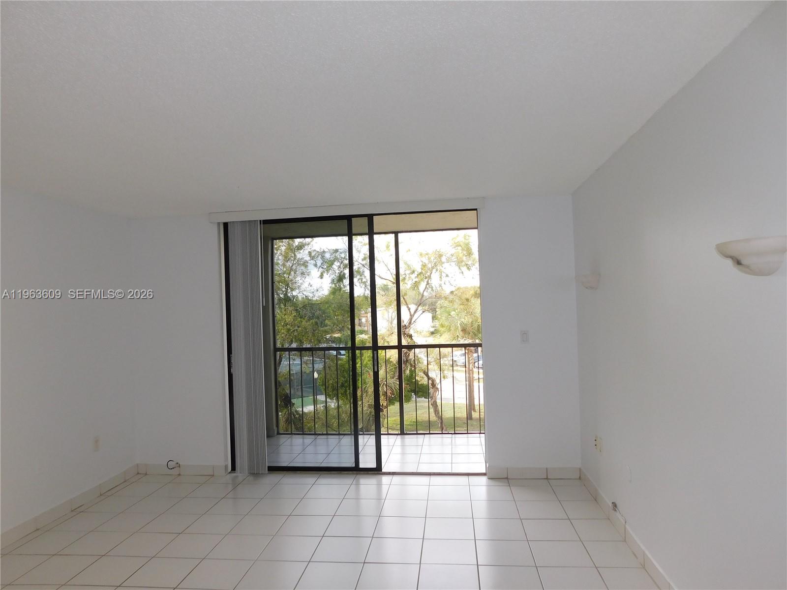 8025 Southwest 107th Avenue, Unit 321 Miami, FL 33173 - Photo 5 of 24 LEADING TO SCEENED PATIO W/STORAGE ROOM