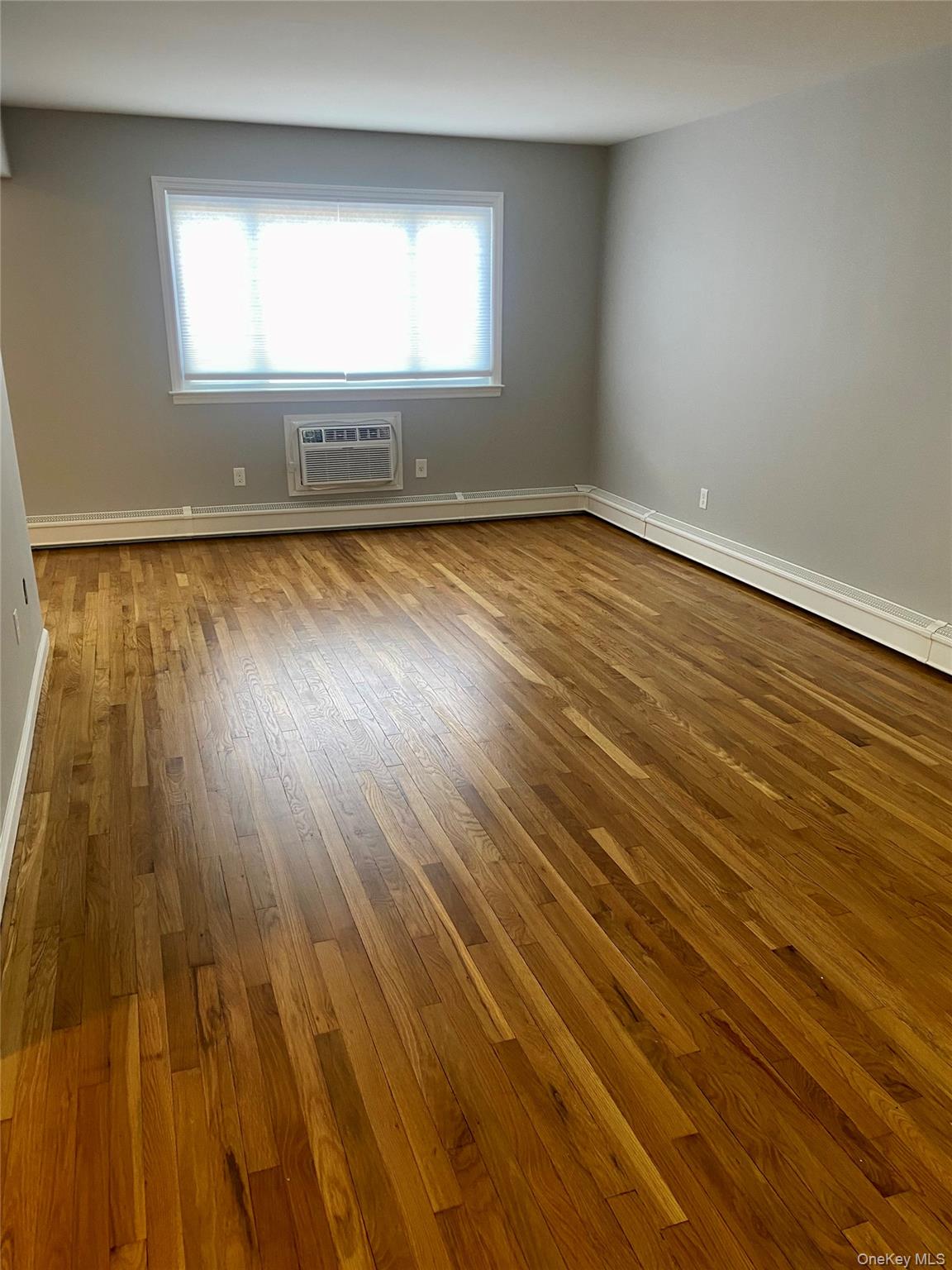 8 North James Street, Unit D Peekskill, NY 10566 - Photo 3 of 9 a view of empty room with wooden floor and fan