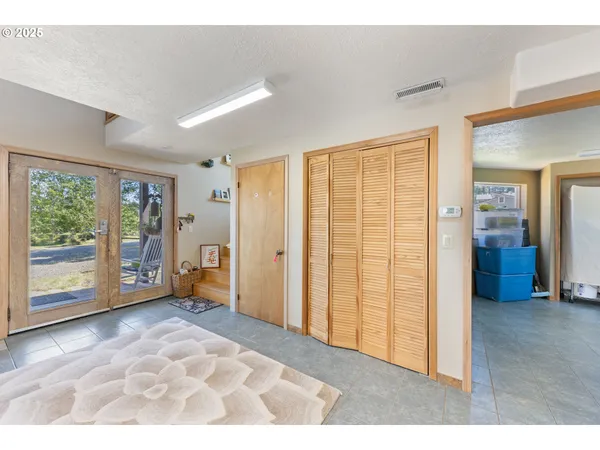 a room with furniture and a book shelf
