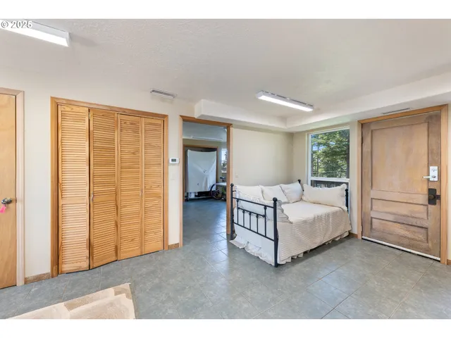 a living room with furniture and walk in closet