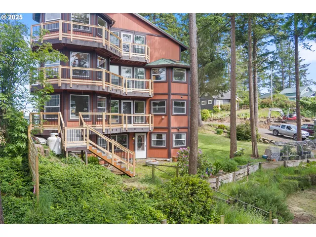 a view of a house with pool and garden