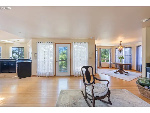 a dining room with furniture a rug and a chandelier