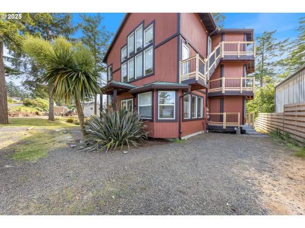 a spacious bedroom with a bed and a cabinet