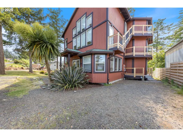 a spacious bedroom with a bed and a cabinet