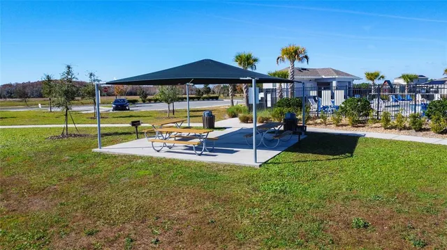a view of a house with a yard porch and sitting area