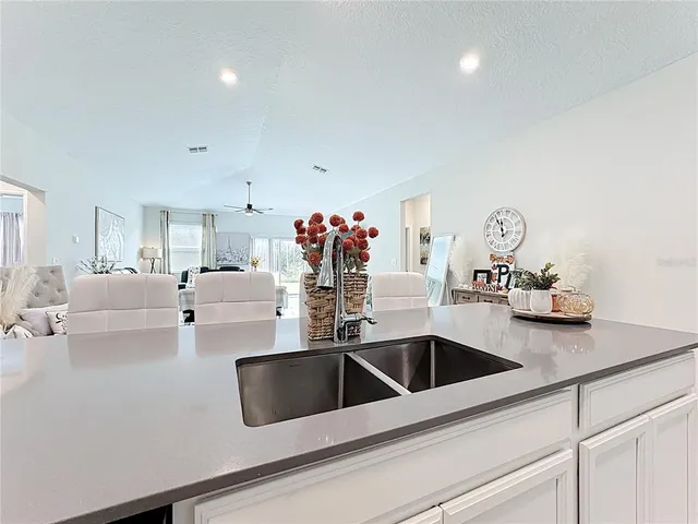a kitchen with kitchen island a white counter top space